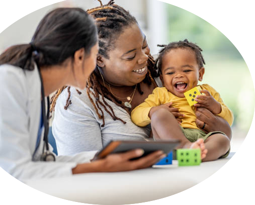 Mother, doctor and child smiling with blocks